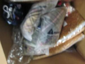 box of rugs, masks , wreath and mor...