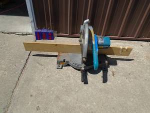 Makita 10 miter saw. Heavy duty unit. Handle has been repaired. Tested & works. As shown.