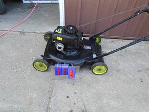 Poulan gas push lawn mower. Nice clean unit. Tested & works. As shown.