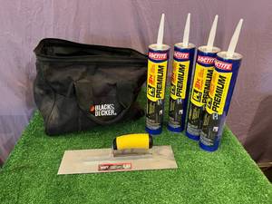 lot 40 image: 28 oz Tubes Adhesive, Finishing Trowel & Black & Decker Bag