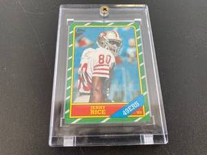 lot 78 image: 1986 Topps Jerry Rice Rookie Card In Acrylic Case