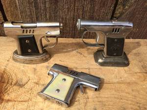 lot 125 image: Vintage Pistol Lighters