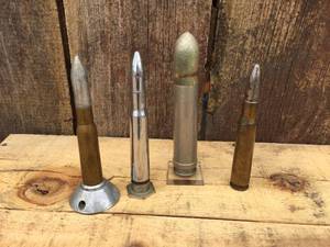 lot 128 image: 4 Vintage Bullet Lighters