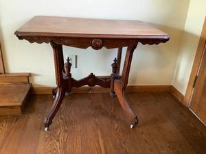 lot 23 image: Walnut Trestle Parlor Table