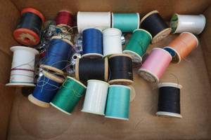 lot 11 image: sewing thread and bobbins