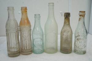 lot 12 image: antique pop bottles