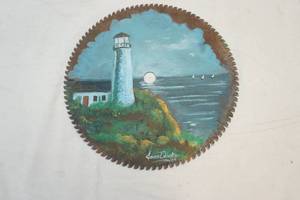 lot 17 image: decorative painted saw blade