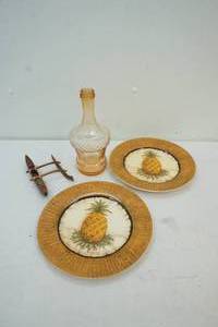 lot 163 image: orange  glass bottle with pineapple plates and wood canoe