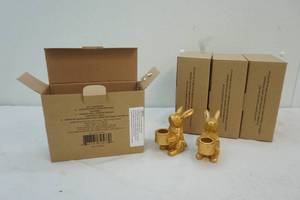 lot 170 image: gold colored bunny candle holders