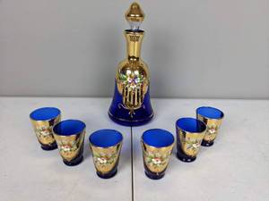 lot 71 image: Vintage Collection of Bohemian Blue Glass Decanter and (6) Shot Glasses with Gold Accent