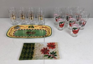 lot 92 image: Assortment of Christmas Glasses and Plates (4) Reindeer Glasses, (7) Coca-Cola Santa Glasses, a Noel Plate and a Pine Cone Plate