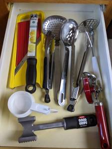lot 103 image: Assortment of Kitchen Utensils Measuring Cups, Tongs, Meat Tenderizer, Can Opener, Zester and More