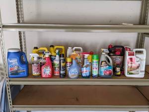 lot 124 image: Assortment of Cleaning and Garage Products Ice Melt, Stain Remover, Zout Spray, Febreze, Raid, Windex, Lysol, Spectracide, Car Wash, Wheel Cleaner, AntifreezeCoolant and More