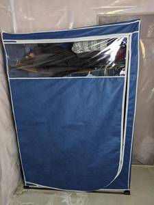 lot 219 image: Blue Portable Wardrobe with Clothes Womens Tops and Bottoms