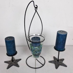 lot 24 image: 3 Blue Oceans Pillar Candles with 1 Hanging Holder and 2 Star Holders from At Home