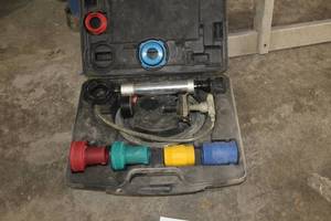 lot 716 image: Unitest Cooling System Pressure Tester Deluxe Kit