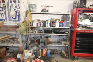 lot 674 image: Metal Storage Rack with Automotive Fluids