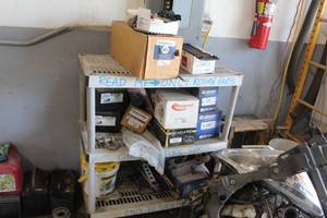 lot 688 image: Contents of Shelving Unit - Misc. Returned Parts - Electrinic Ignitor, Alternator, Starter, Calipers, Power Steering
