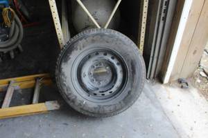 lot 753 image: Firestone Transforce HT Tire with 8-Lug 17 Steel Rim