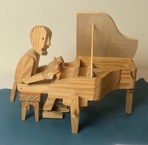 lot 135 image: ArticulatedMoveable Piano Player Puzzle Figurine