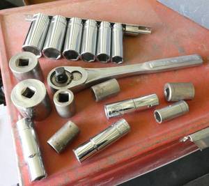 38 inch sockets and ratchet in a plastic tool box
