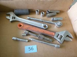 box of ratchet extensions and wrenches