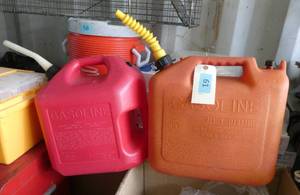 2 plastic 5 gallon gas cans