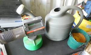 Bug smoker, citronella candle, watering can, mole trap, garden tools