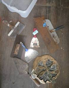 Tote full of concrete, muddin tools and nail bag