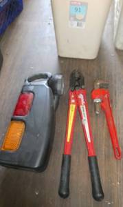 Waste basket with emergency light, pipe wrench and bolt cutter