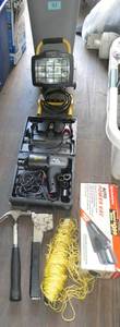 Waste basket with portable light, car impact wrench, vac, hammer, stapler