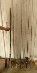 Lot of fishing poles including one fiberglass extending one