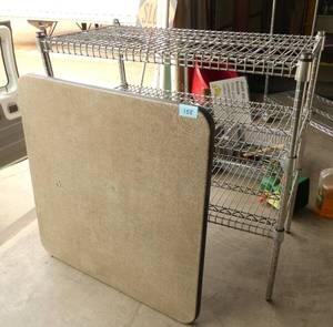 Card table and a 3 shelf metal shelf 35 inches wide, 37 tall
