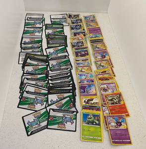 Group Of Pokemon Trading Cards And Code Cards