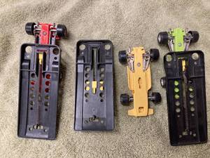 Three Small Plastic Formula 1 Cars each with a Spring-Loaded Launcher