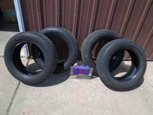 Qty of 4 used Bridgestone Blizzak Revo 1 p19560r15 tires. Approximately 12 tread left. As shown.