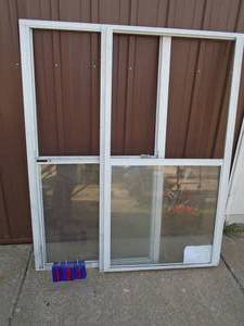 Qty of 2 New aluminum frame sliding windows. Rough opening 61 x 32 12. As shown.