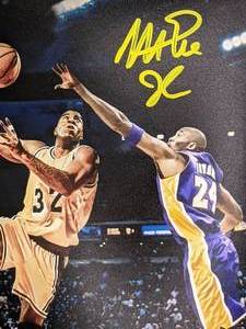 lot 101 image: Magic vs Kobe Lakers 8x10 Photo Hand-Signed by Magic Johnson Beckett Certified