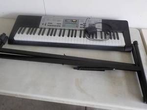 Casio with Charger and Stand...