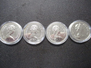 55. Lot of (4) 1679 - 1979 Griffon Canadian Silver Dollars in Protective Cases
