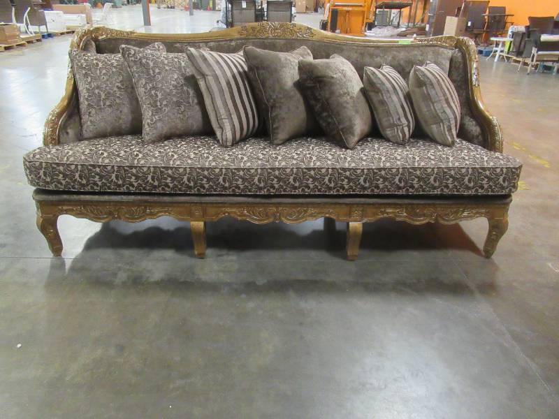 lot 119 image: Celina Deniece 96 Chenille Recessed Arm Sofa with 7 Reversible Pillows - Missing 1 Support leg in the back (See Photo).