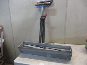 lot 31 image: 2 adjustable rollers and a sawhorse