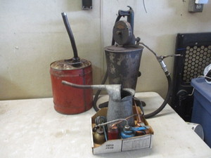 lot 108 image: Oil cans, Oil tank and gas can
