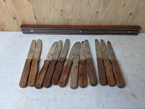 lot 388 image: Magnetic Knife Rack with (12) Winco Jumbo Steak Knives 5 Blade Wooden Handle Round Tip, Model# KB-15W