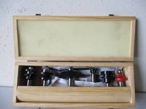 lot 18 image: Woodworking Tools-Price Cutter Router Shaper Bits in wood case.