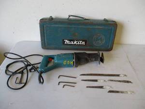 lot 35 image: Makita SawzawReciprocating Saw in Metal Case with saw blades and Allen wrenches.