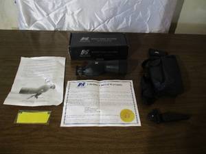 lot 70 image: NC Star Spotting Scope with tripod in box.