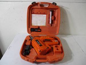 lot 107 image: Paslode Cordless Framing Nailer, Charger, 1 gas Cylinder,1 battery all in case. Works.