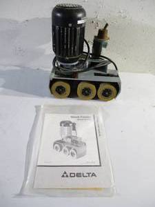 lot 109 image: Delta Stock Feeder with Instructions.