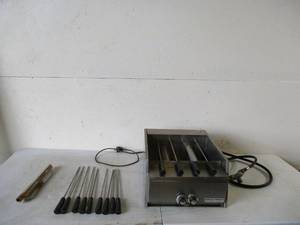 lot 133 image: Miracle Broiler with skewers.